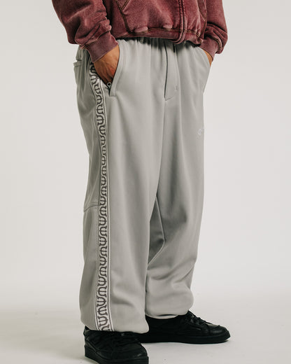 E LOGO TRACK PANTS - GREY