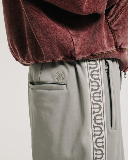 E LOGO TRACK PANTS - BROWN